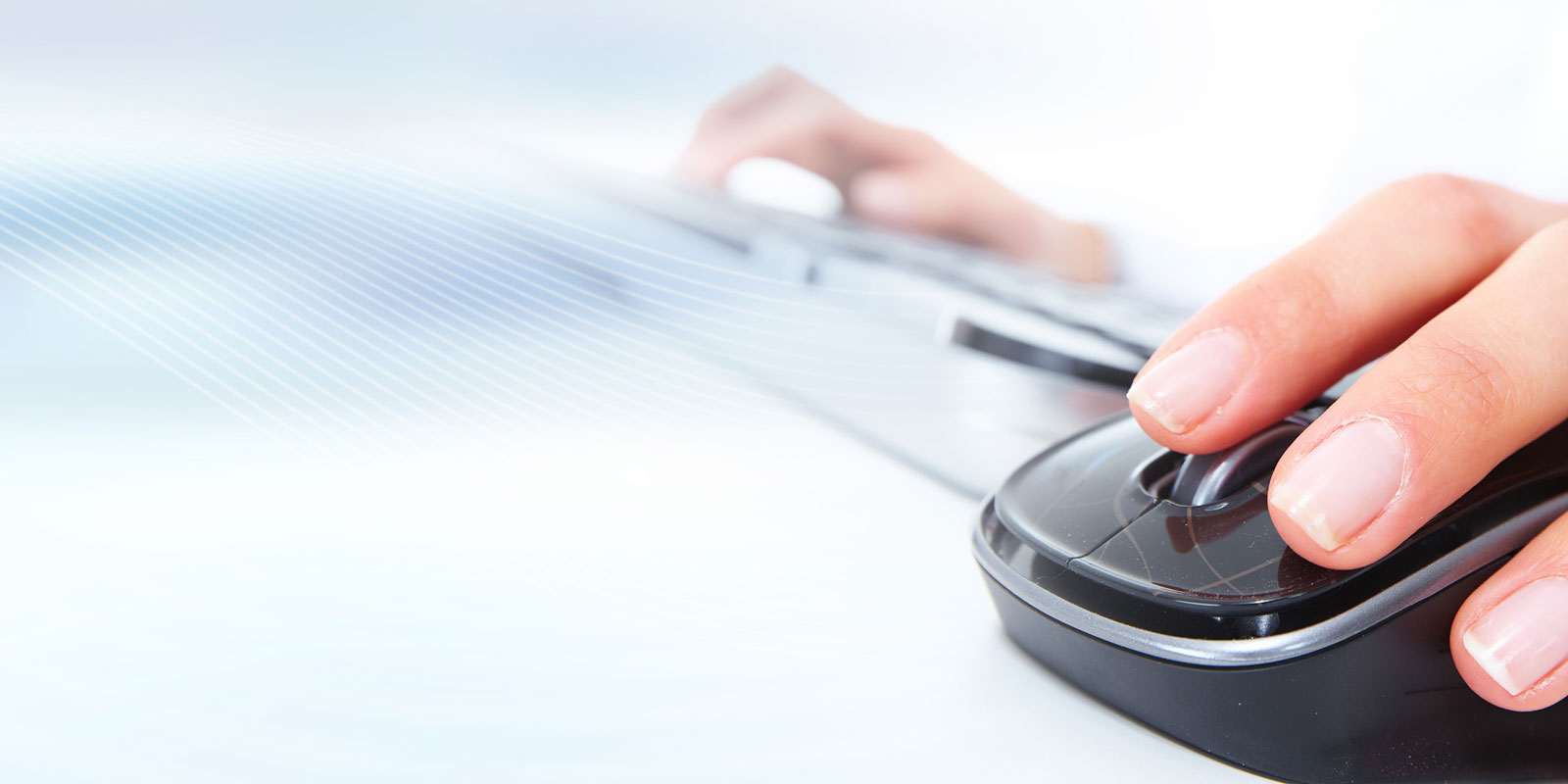 Close up of hand on computer mouse.