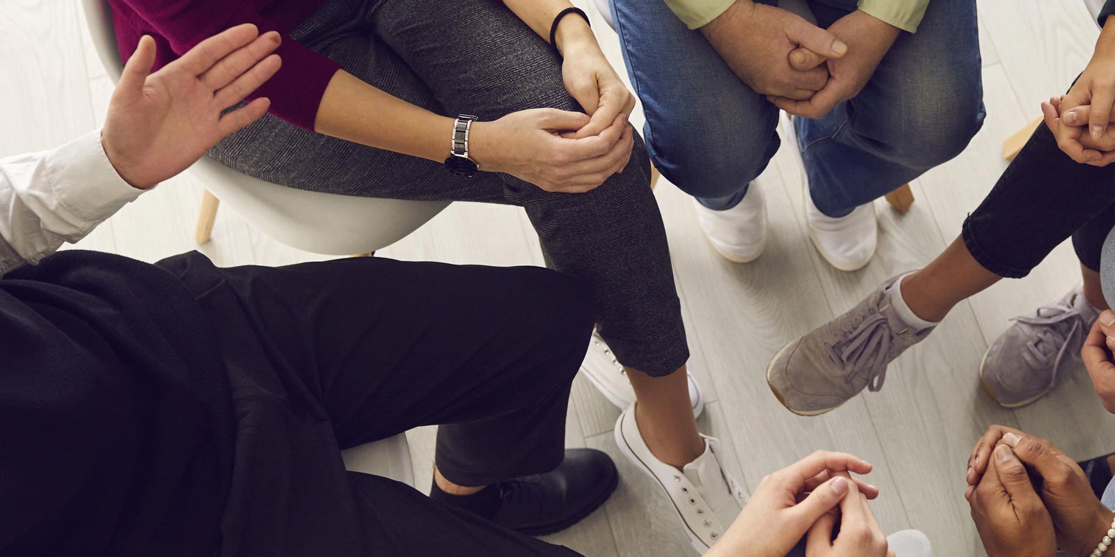 Group of people sitting in a circle.
